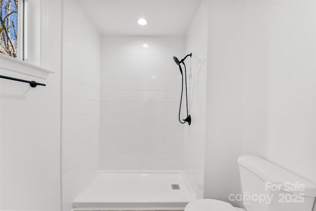 full bath featuring toilet, a stall shower, and recessed lighting