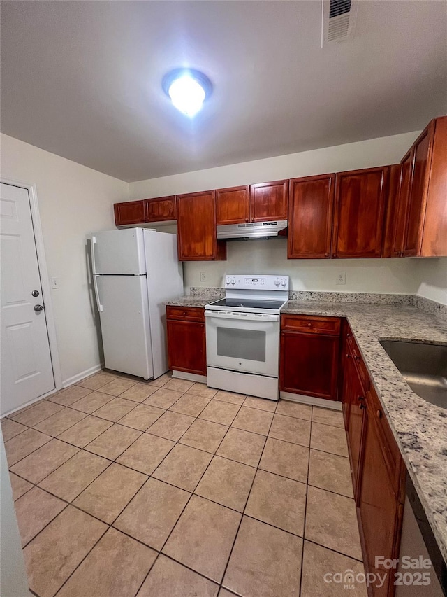kitchen featuring visible vents, white appliances, under cabinet range hood, a sink, and light tile patterned floors