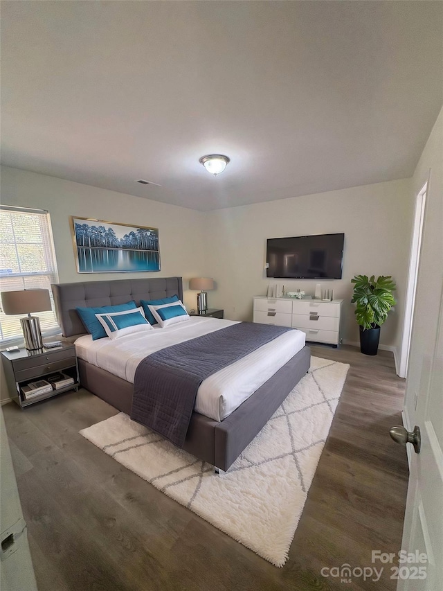 bedroom with wood finished floors