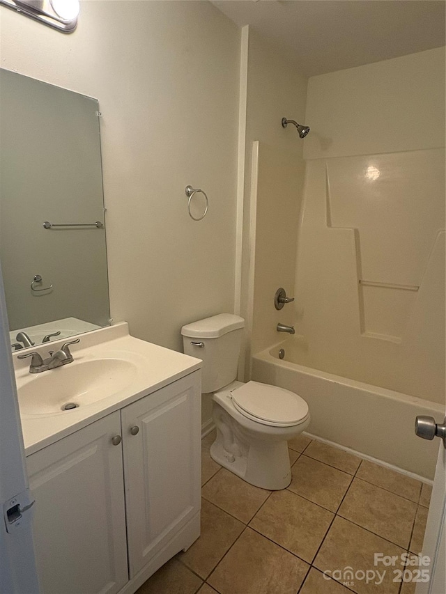 full bathroom featuring toilet, vanity,  shower combination, and tile patterned flooring