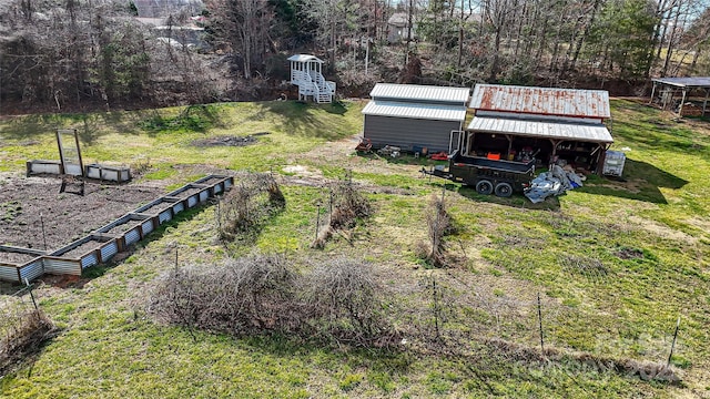 view of yard with an outbuilding and a garden