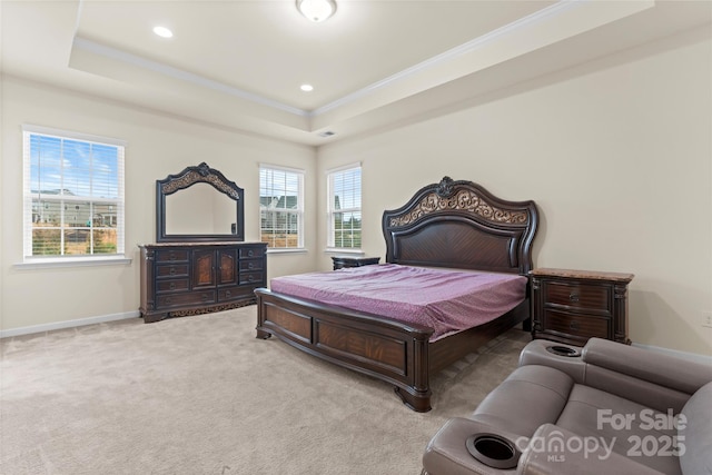 bedroom with a raised ceiling, ornamental molding, recessed lighting, baseboards, and light colored carpet