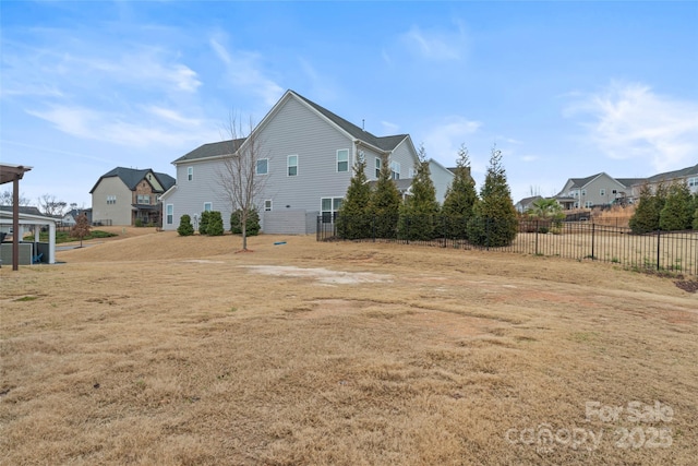 view of yard featuring a residential view and fence