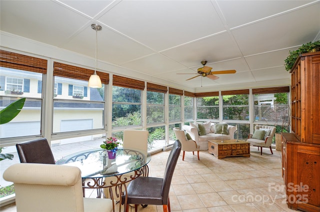 sunroom with a ceiling fan