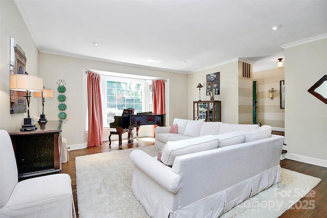 living area featuring dark wood finished floors, recessed lighting, visible vents, ornamental molding, and baseboards