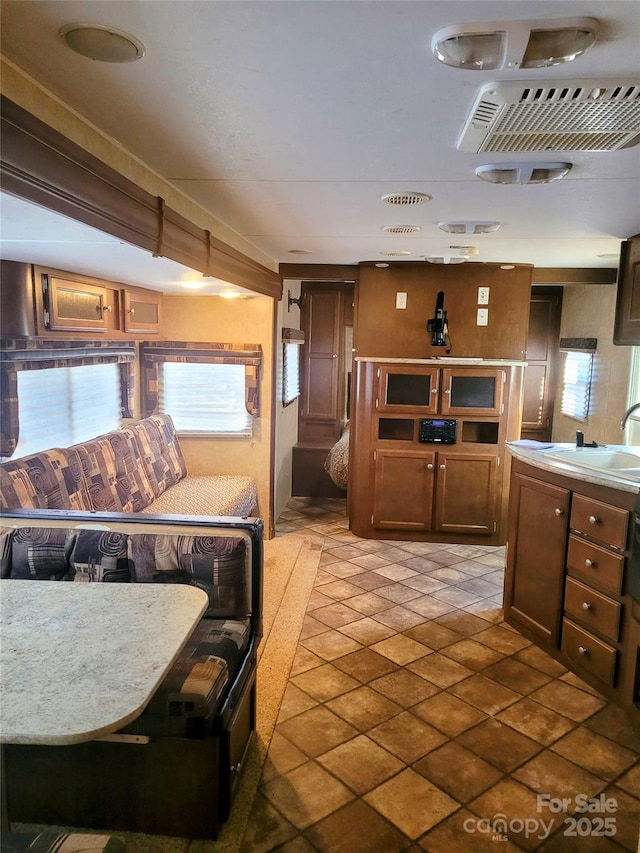 kitchen featuring a healthy amount of sunlight, light countertops, and a sink