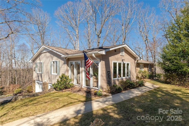 ranch-style house with a front lawn