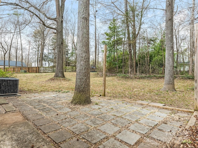 view of patio / terrace featuring fence and central AC