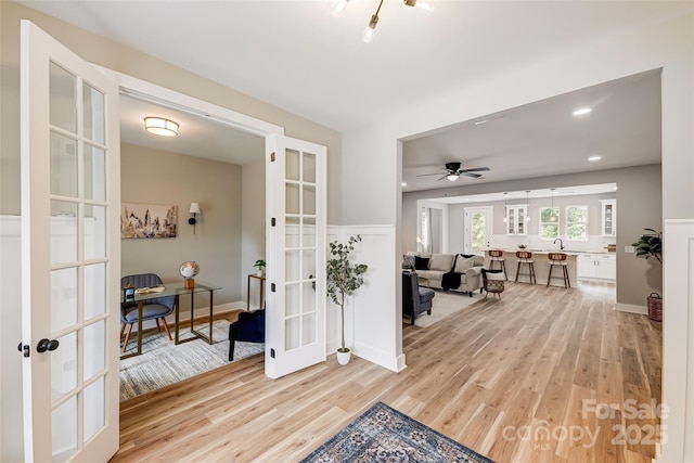 interior space featuring recessed lighting, light wood-style flooring, ceiling fan, and french doors