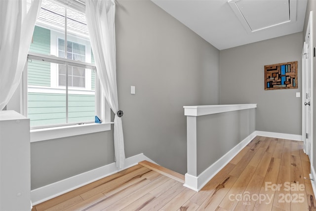 interior space with light wood-style flooring and baseboards