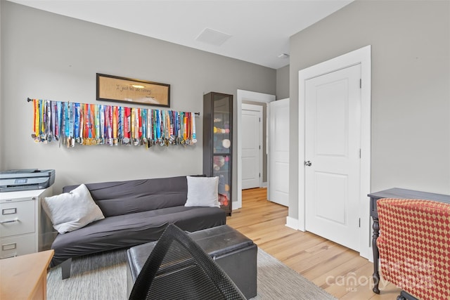 sitting room with light wood-style floors