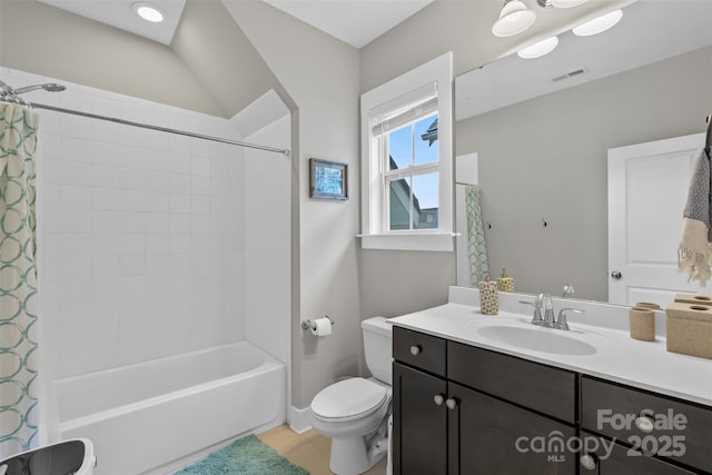 full bath featuring visible vents, toilet, vanity, and shower / bath combination with curtain