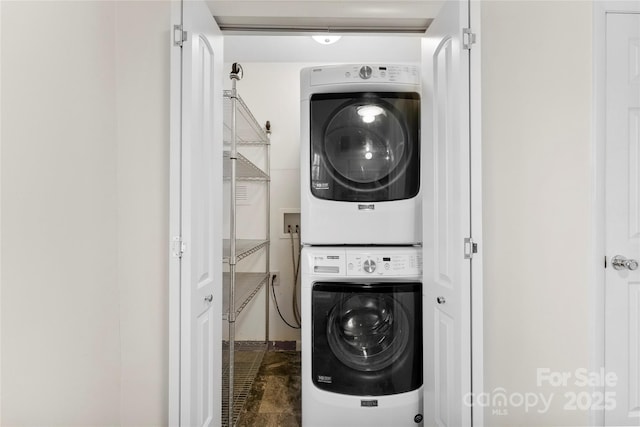 washroom with laundry area and stacked washer and clothes dryer