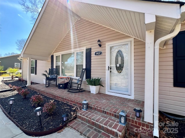 property entrance featuring covered porch