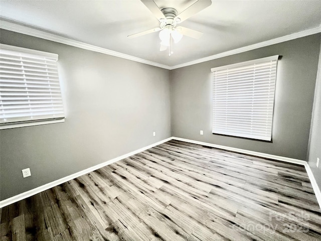 unfurnished room featuring baseboards and ornamental molding