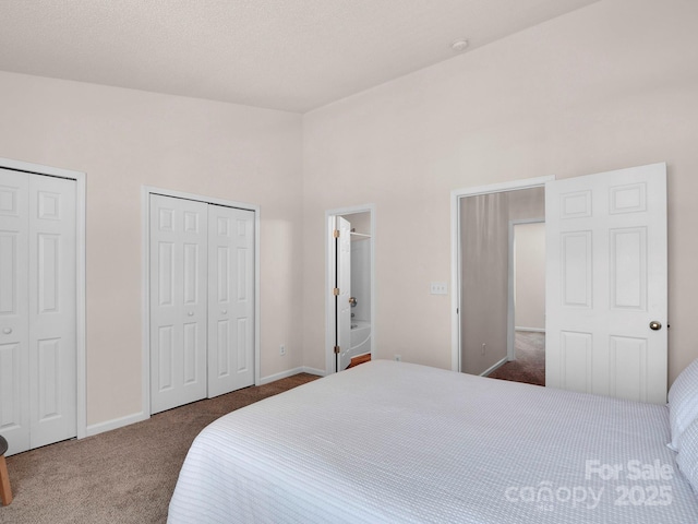 carpeted bedroom with baseboards and multiple closets