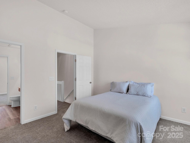 bedroom featuring carpet flooring, baseboards, and a towering ceiling