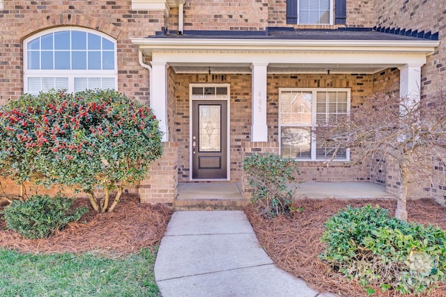 entrance to property with brick siding