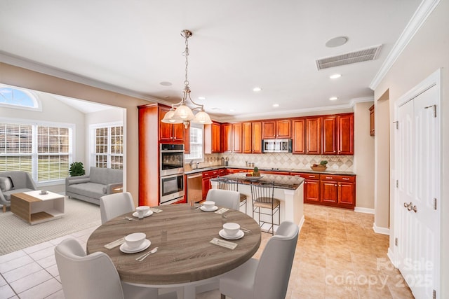 dining room with ornamental molding, recessed lighting, visible vents, and light tile patterned floors