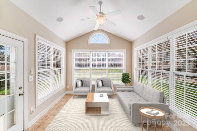 sunroom featuring vaulted ceiling and a ceiling fan