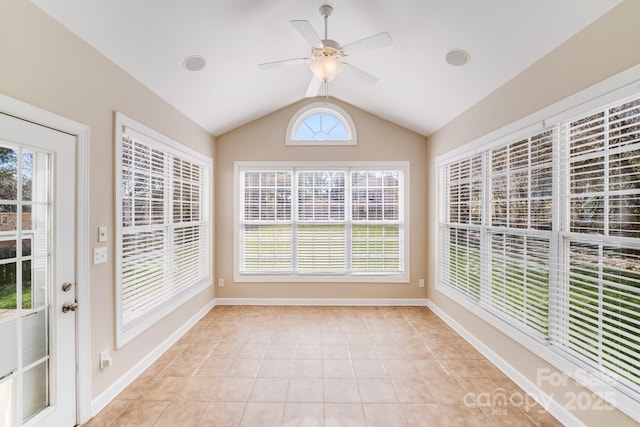 unfurnished sunroom featuring a wealth of natural light, lofted ceiling, and ceiling fan