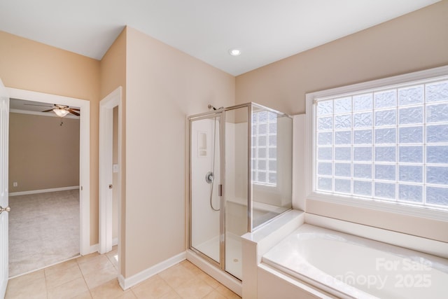 bathroom with ceiling fan, tile patterned flooring, a shower stall, and a bath