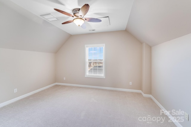 bonus room with ceiling fan, light carpet, visible vents, baseboards, and vaulted ceiling