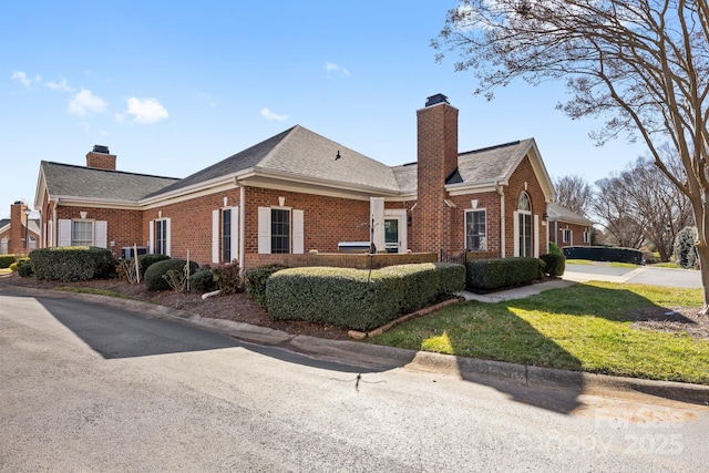 8328 Highland Glen Dr, Charlotte, NC 28269 - view of side of property featuring brick siding, a yard, and a chimney