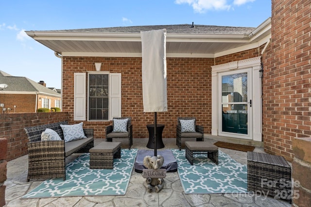 view of patio featuring fence and an outdoor hangout area