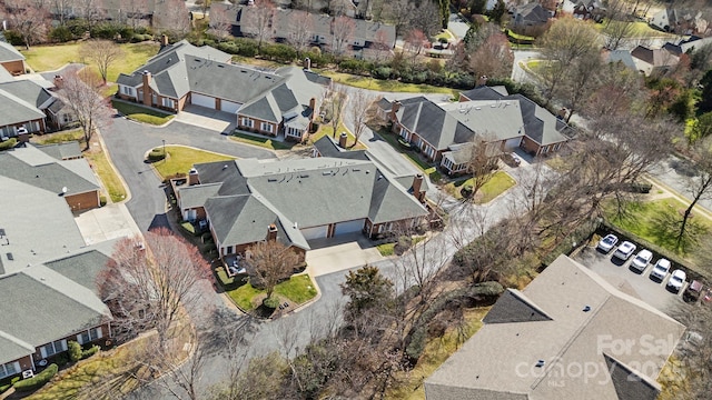 birds eye view of property with a residential view