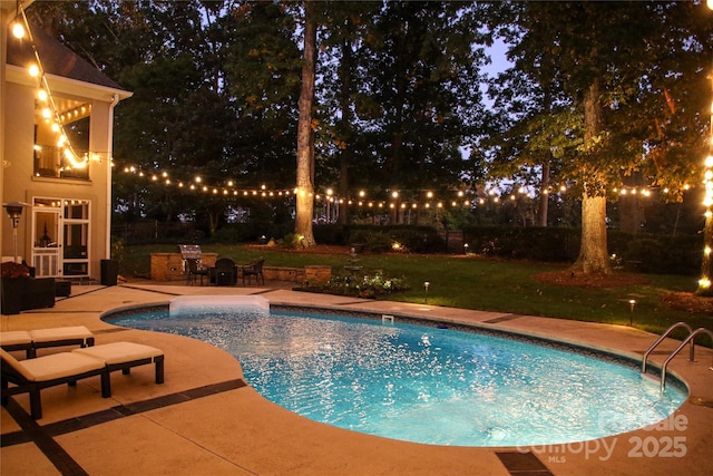 outdoor pool with a patio area and a lawn