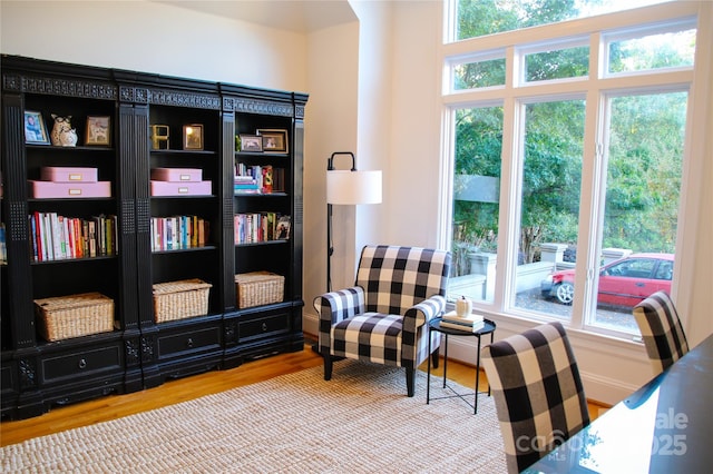 living area featuring wood finished floors and baseboards