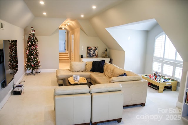 living area featuring lofted ceiling, recessed lighting, light carpet, visible vents, and stairway