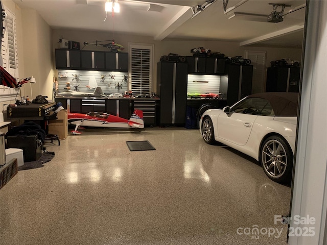 garage featuring a workshop area and a garage door opener