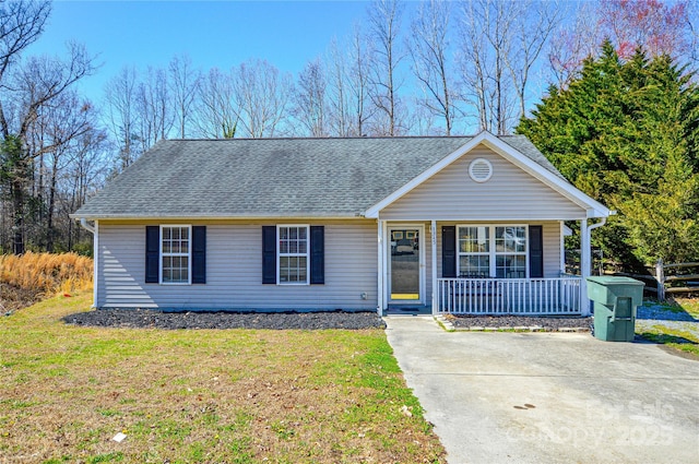 single story home featuring a front lawn, covered porch, and roof with shingles