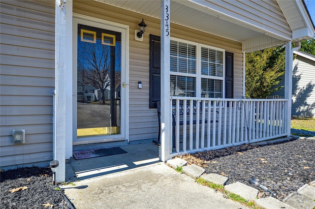 entrance to property featuring a porch