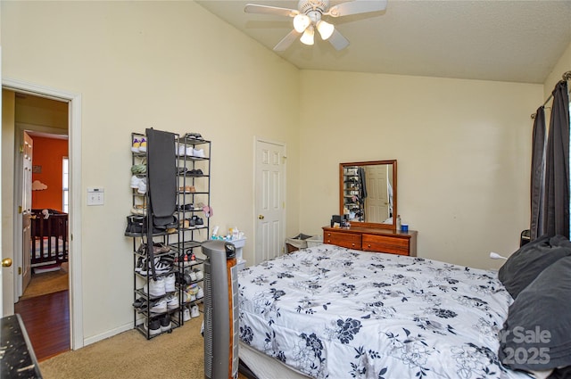 bedroom featuring ceiling fan, light colored carpet, baseboards, and high vaulted ceiling