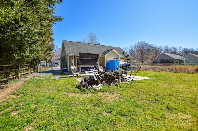 view of yard featuring a patio, a gate, and a fenced backyard