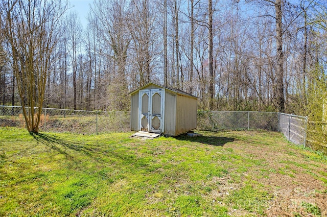 view of yard with a fenced backyard, a shed, and an outdoor structure