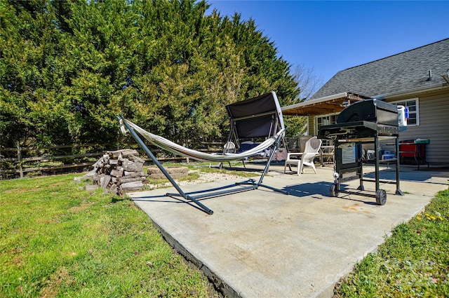 view of patio / terrace featuring fence