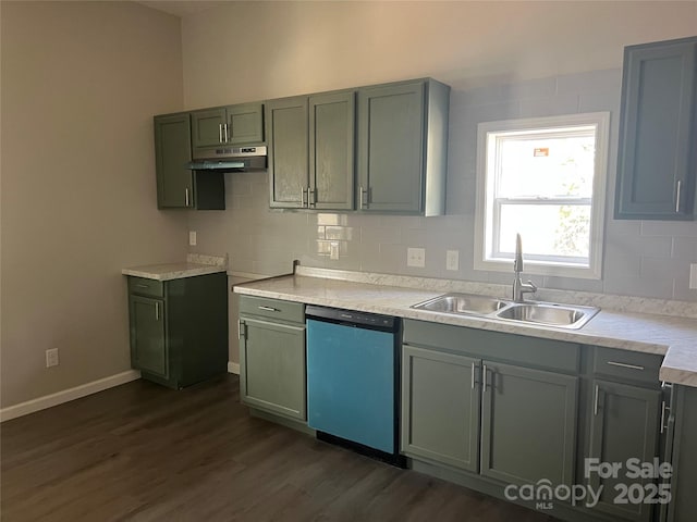 kitchen with dishwashing machine, under cabinet range hood, dark wood-style flooring, a sink, and light countertops