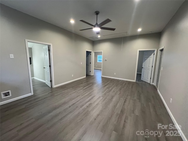 interior space featuring attic access, visible vents, dark wood finished floors, baseboards, and recessed lighting