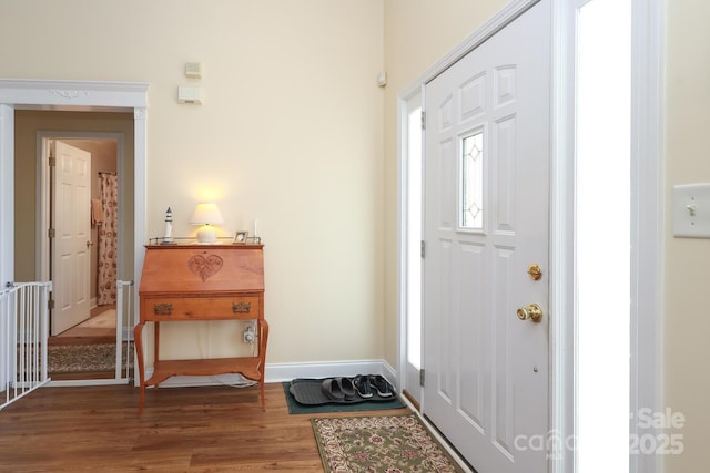 entrance foyer with wood finished floors and baseboards