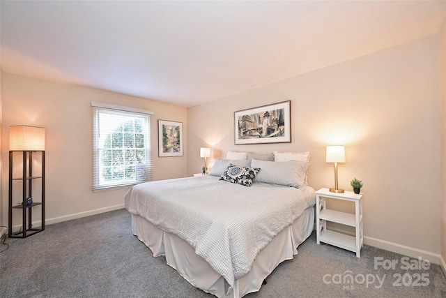 bedroom featuring carpet and baseboards