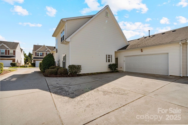 view of home's exterior featuring driveway and an attached garage