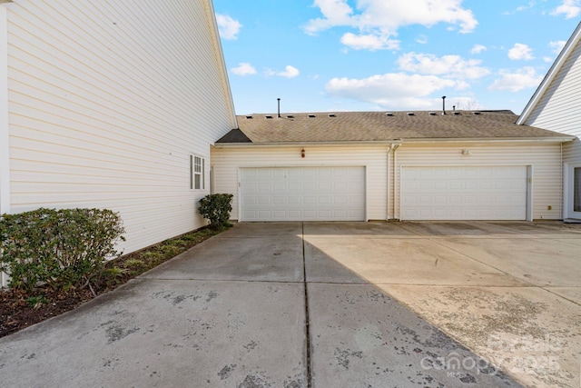 garage featuring driveway