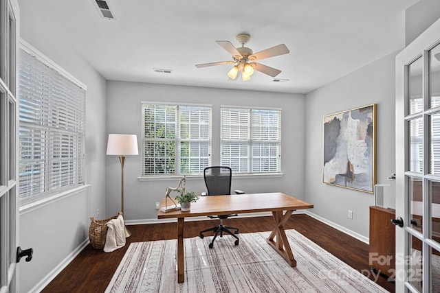 office space featuring visible vents, wood finished floors, and baseboards