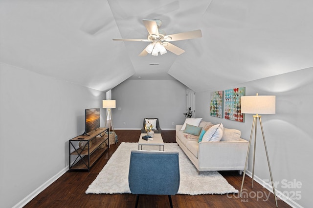 living area featuring visible vents, baseboards, vaulted ceiling, wood finished floors, and a ceiling fan