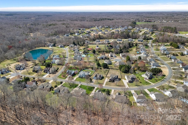 drone / aerial view with a residential view and a water view