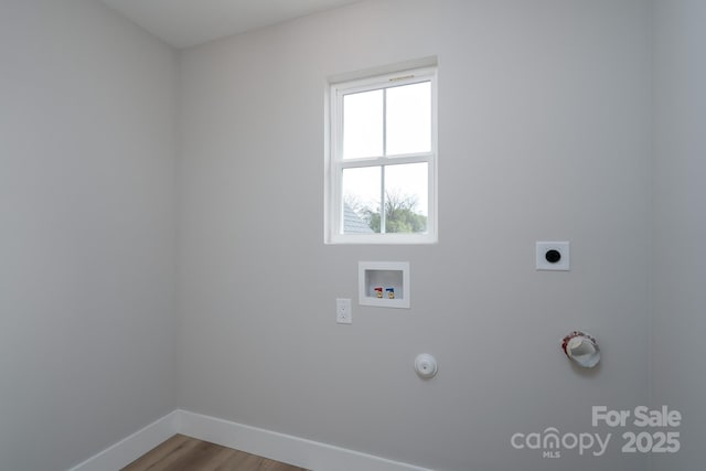 laundry room featuring hookup for a gas dryer, laundry area, washer hookup, baseboards, and electric dryer hookup